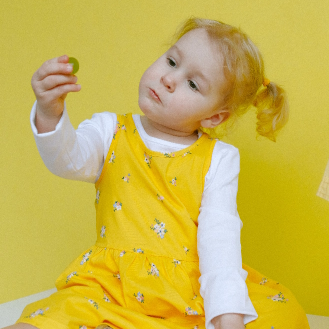 young girl in yellow dress
